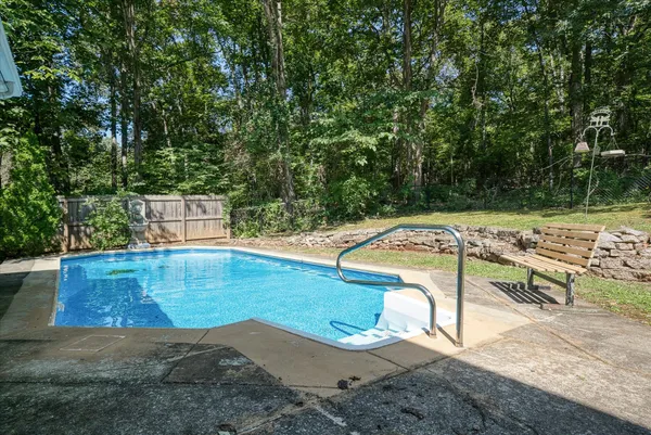 a view of a swimming pool with a patio