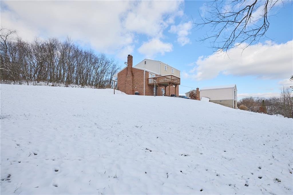 151 Stone Quarry Road Aliquippa, PA 15001 - Photo 25 of 26 a view of a dry yard with snow on the road