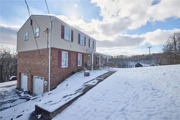 a aerial view of a house with a yard