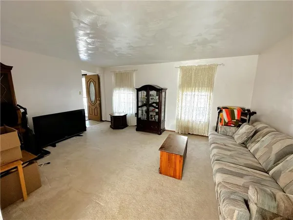 a bedroom with furniture and window