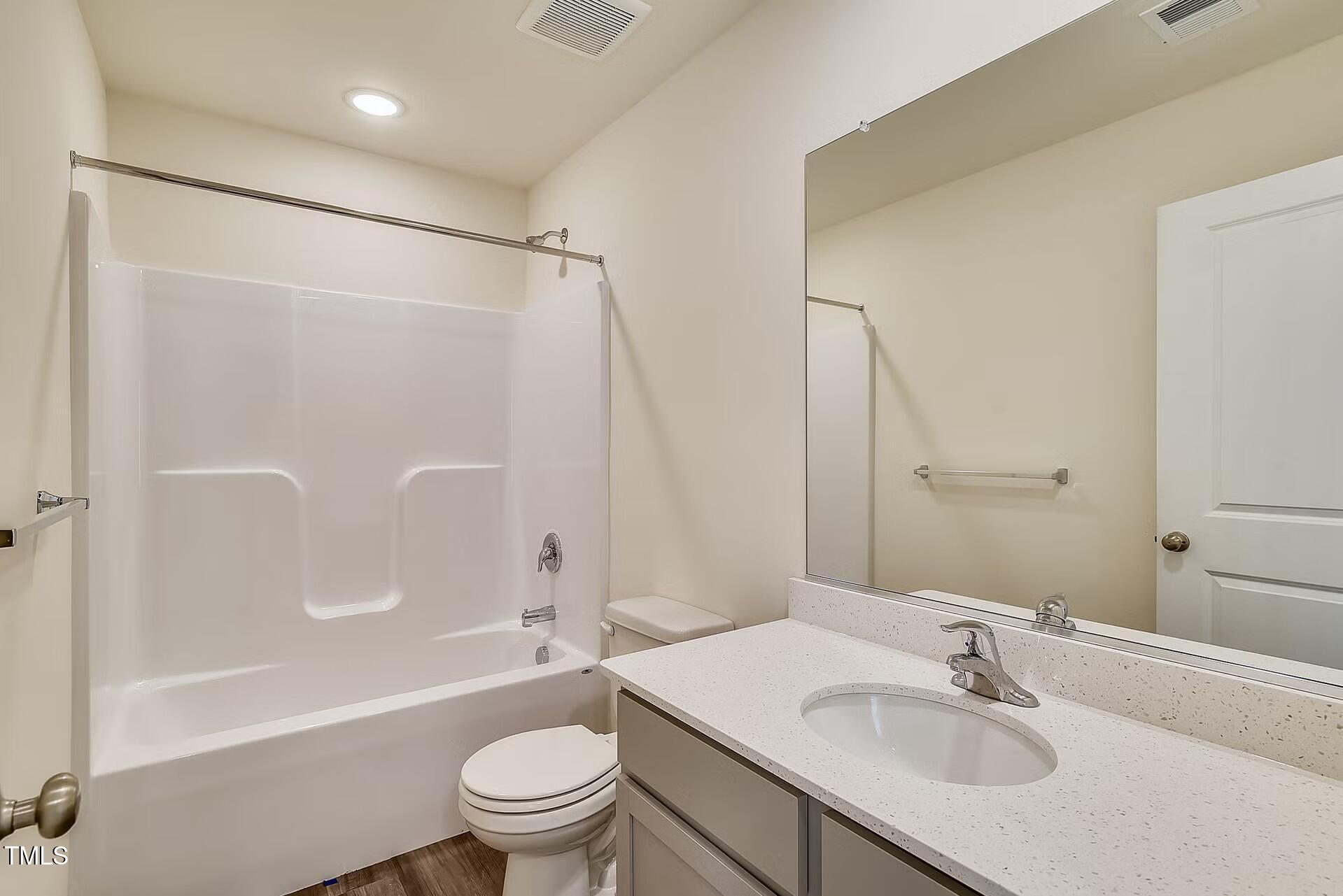 2700 Barrington Drive Raleigh, NC 27610 - Photo 17 of 27 a bathroom with a sink toilet and shower