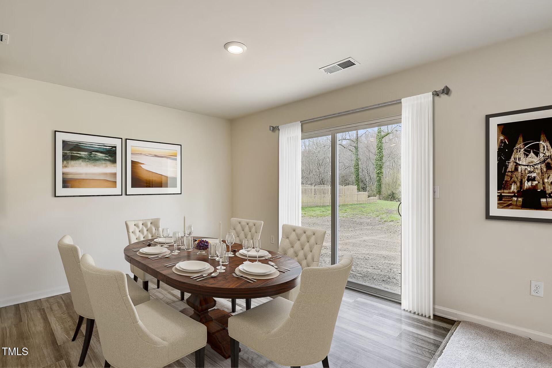 2700 Barrington Drive Raleigh, NC 27610 - Photo 4 of 27 a view of a dining room with furniture window and wooden floor
