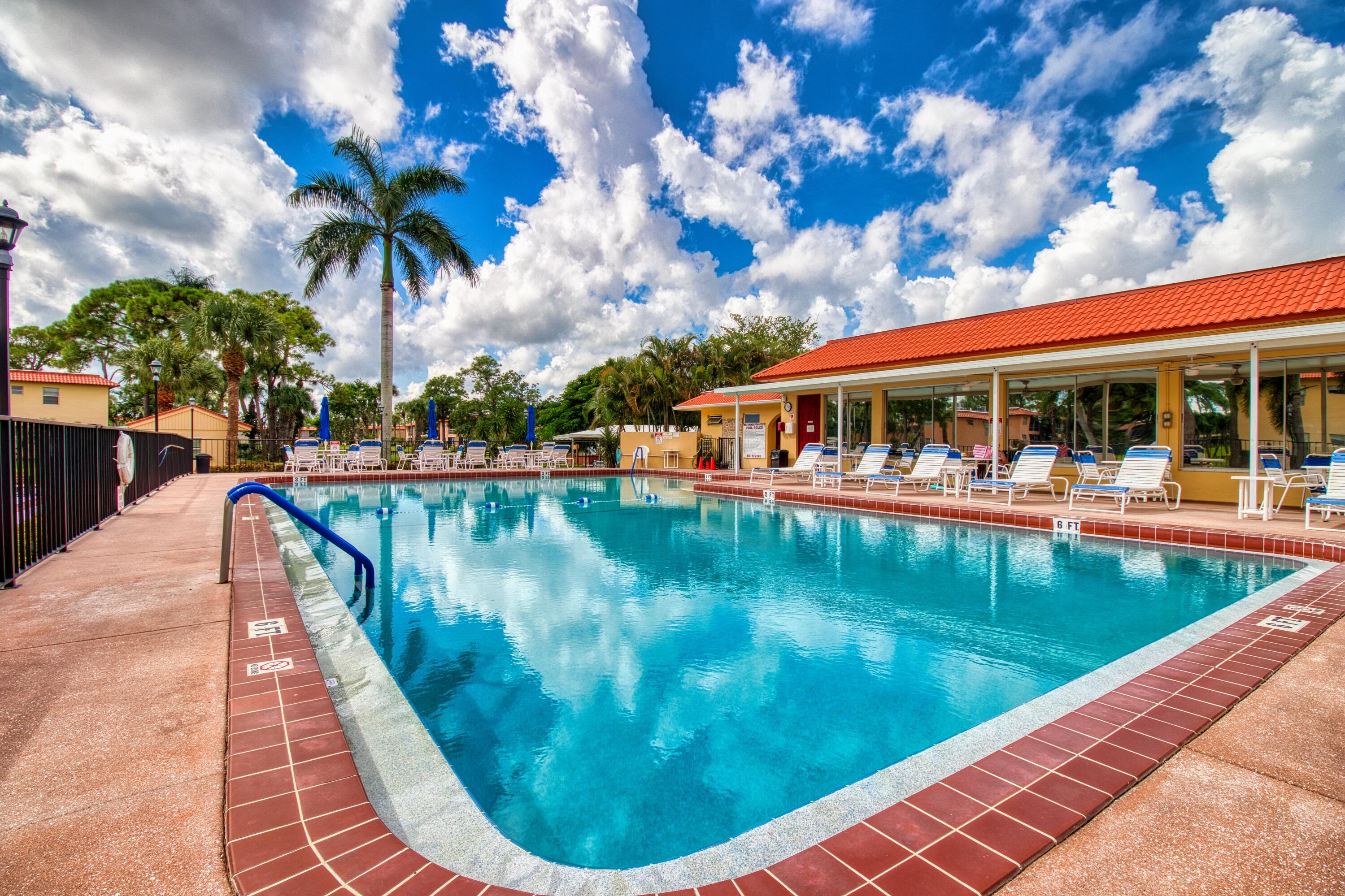 1911 Southwest Palm City Road, Unit J Stuart, FL 34994 - Photo 16 of 42 a view of swimming pool with a patio