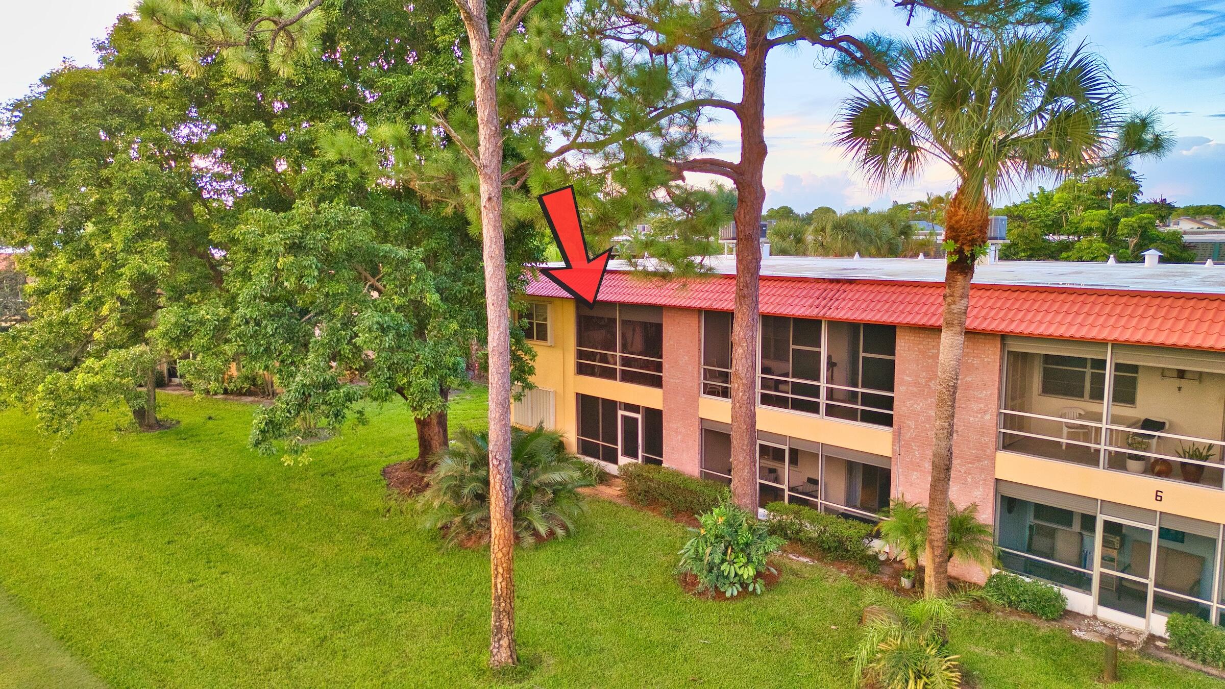1911 Southwest Palm City Road, Unit J Stuart, FL 34994 - Photo 2 of 42 a view of a house with a yard