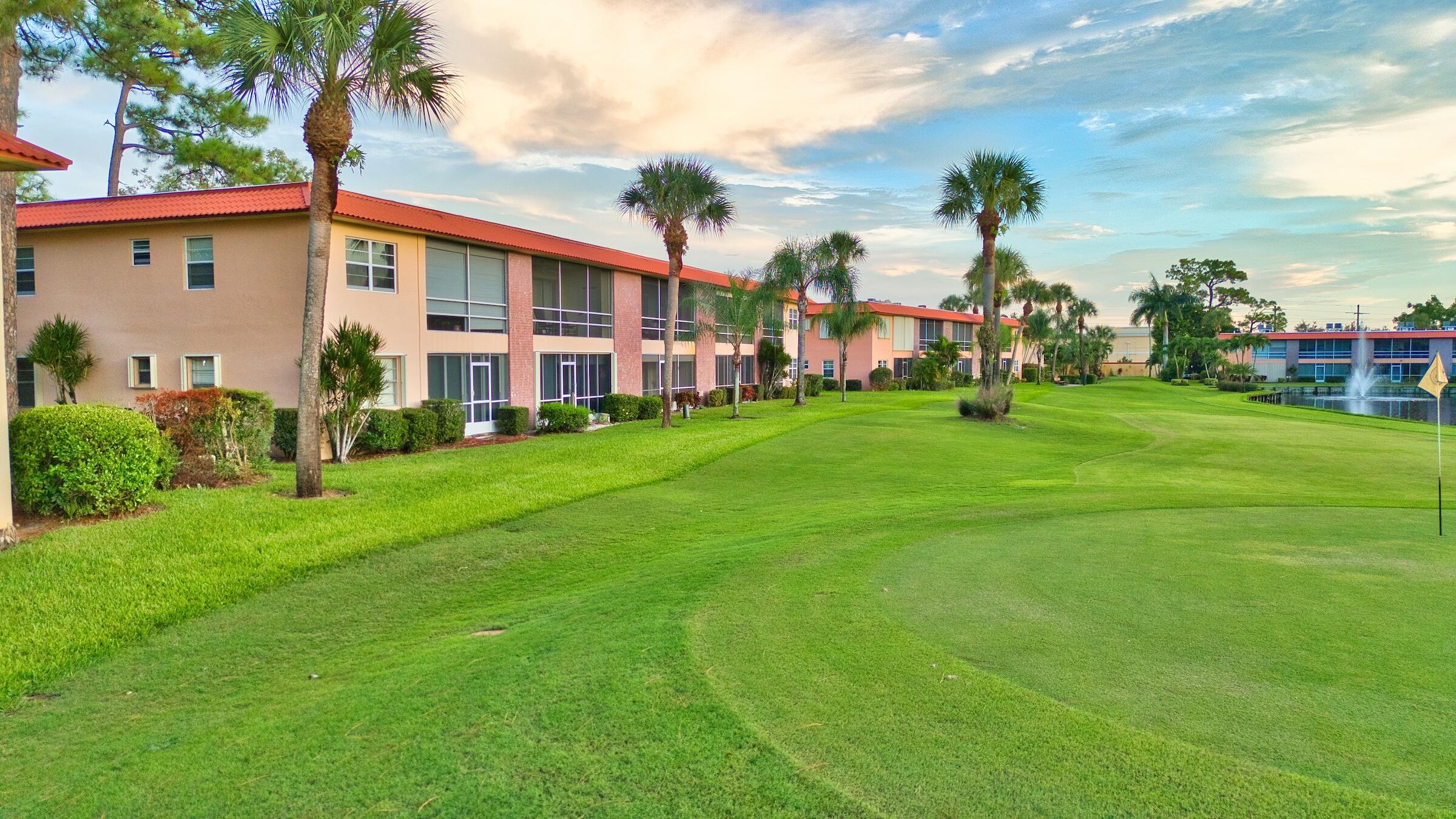 1911 Southwest Palm City Road, Unit J Stuart, FL 34994 - Photo 22 of 42 a view of a house with a backyard