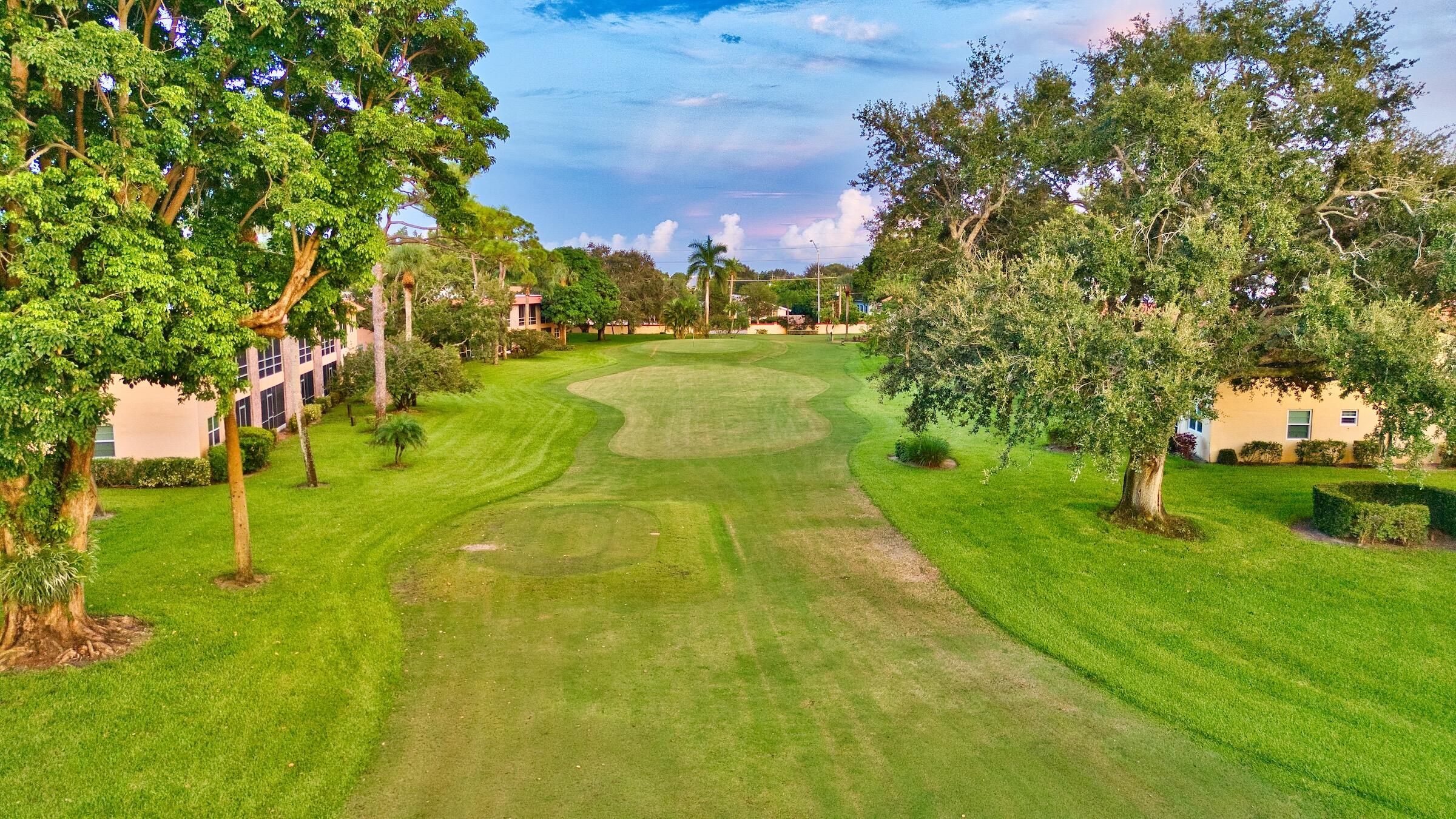 1911 Southwest Palm City Road, Unit J Stuart, FL 34994 - Photo 24 of 42 a view of yard with swimming pool