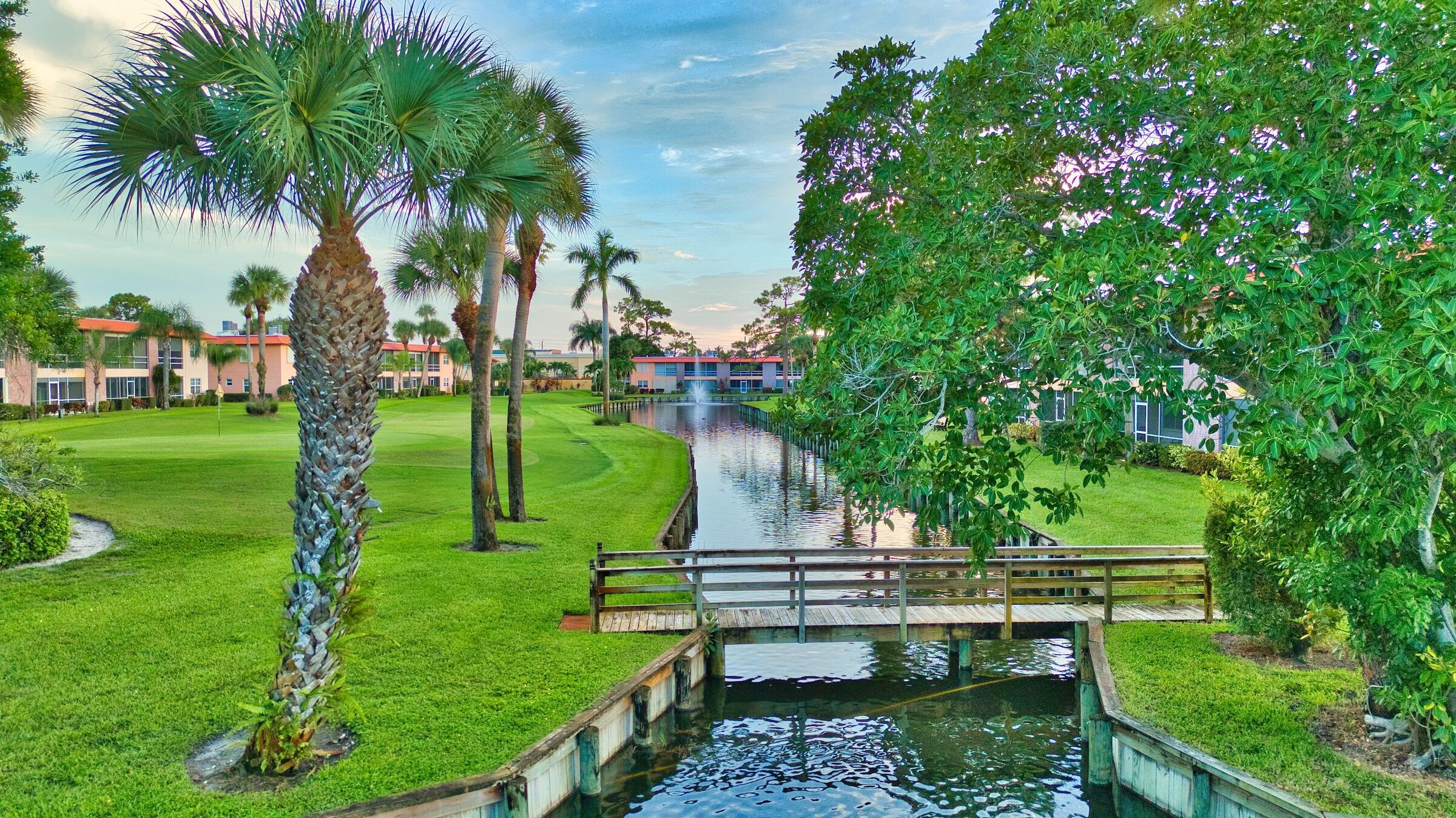 1911 Southwest Palm City Road, Unit J Stuart, FL 34994 - Photo 25 of 42 a view of a park with large trees