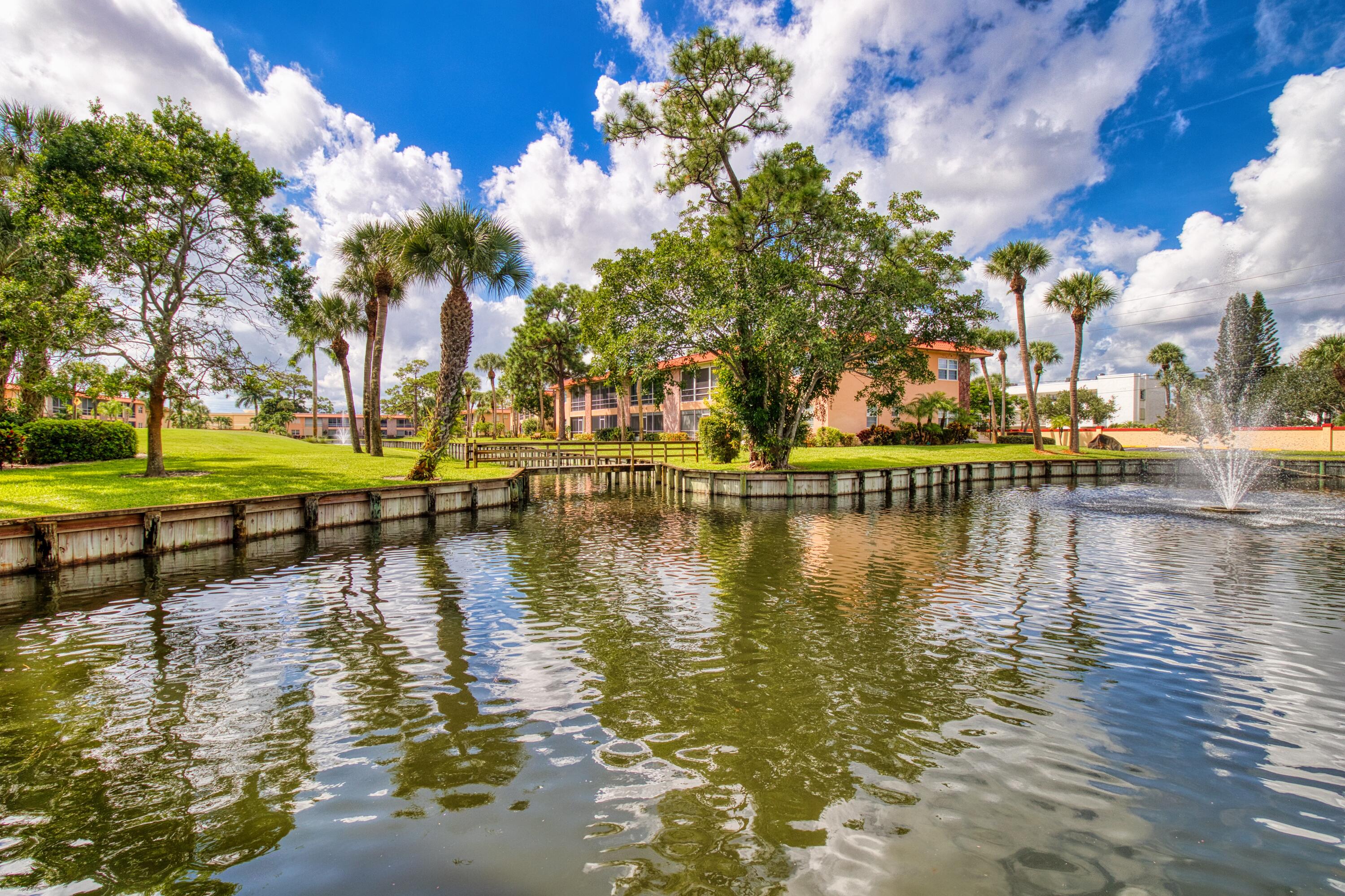 1911 Southwest Palm City Road, Unit J Stuart, FL 34994 - Photo 29 of 42 a view of residential houses with outdoor space and lake view