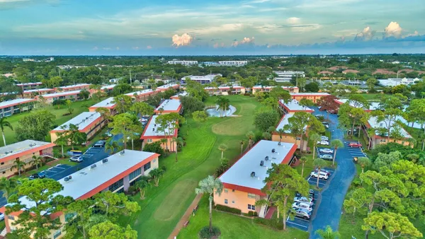 an aerial view of a house with a garden