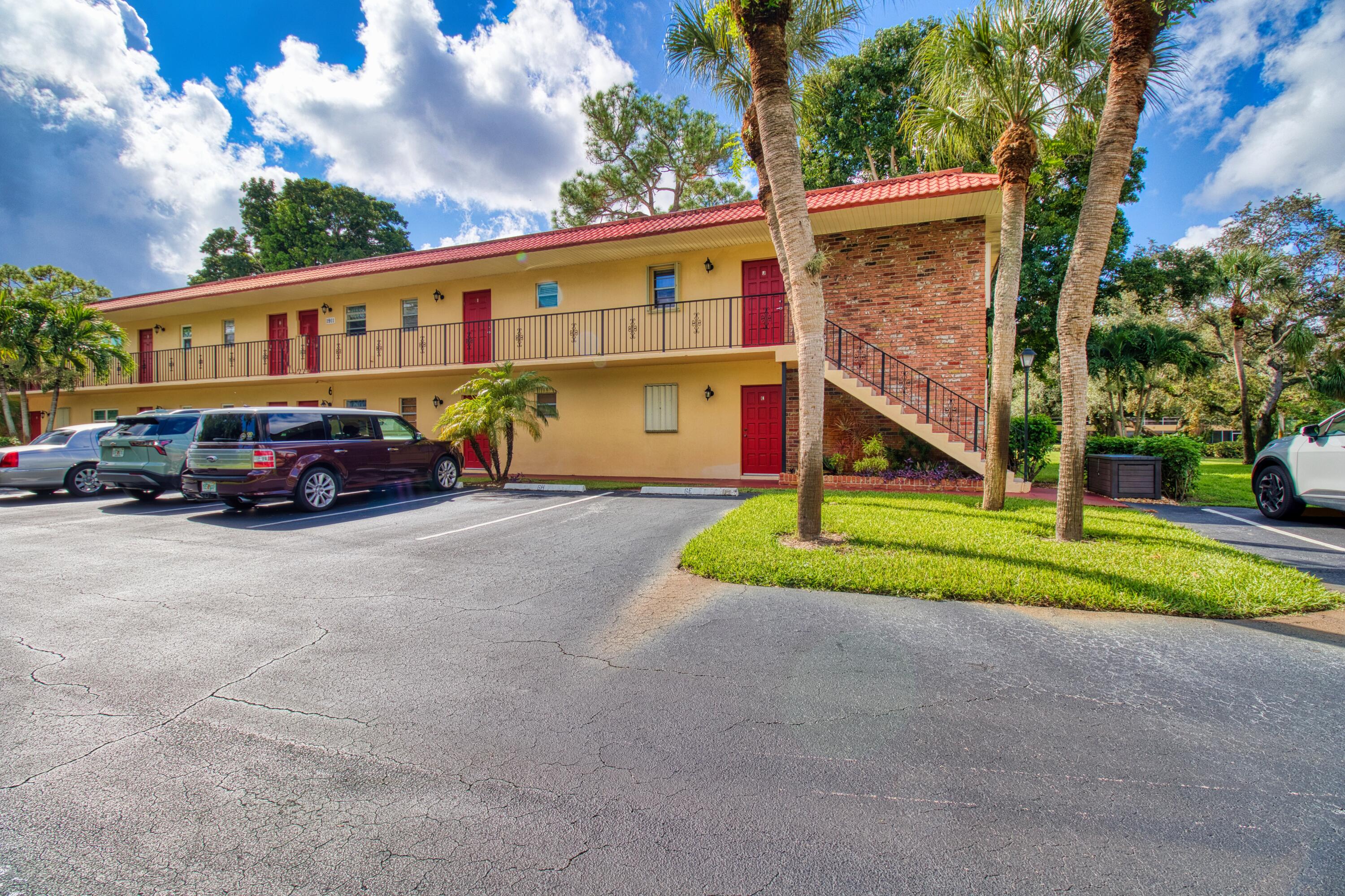 1911 Southwest Palm City Road, Unit J Stuart, FL 34994 - Photo 42 of 42 a front view of house with yard and green space