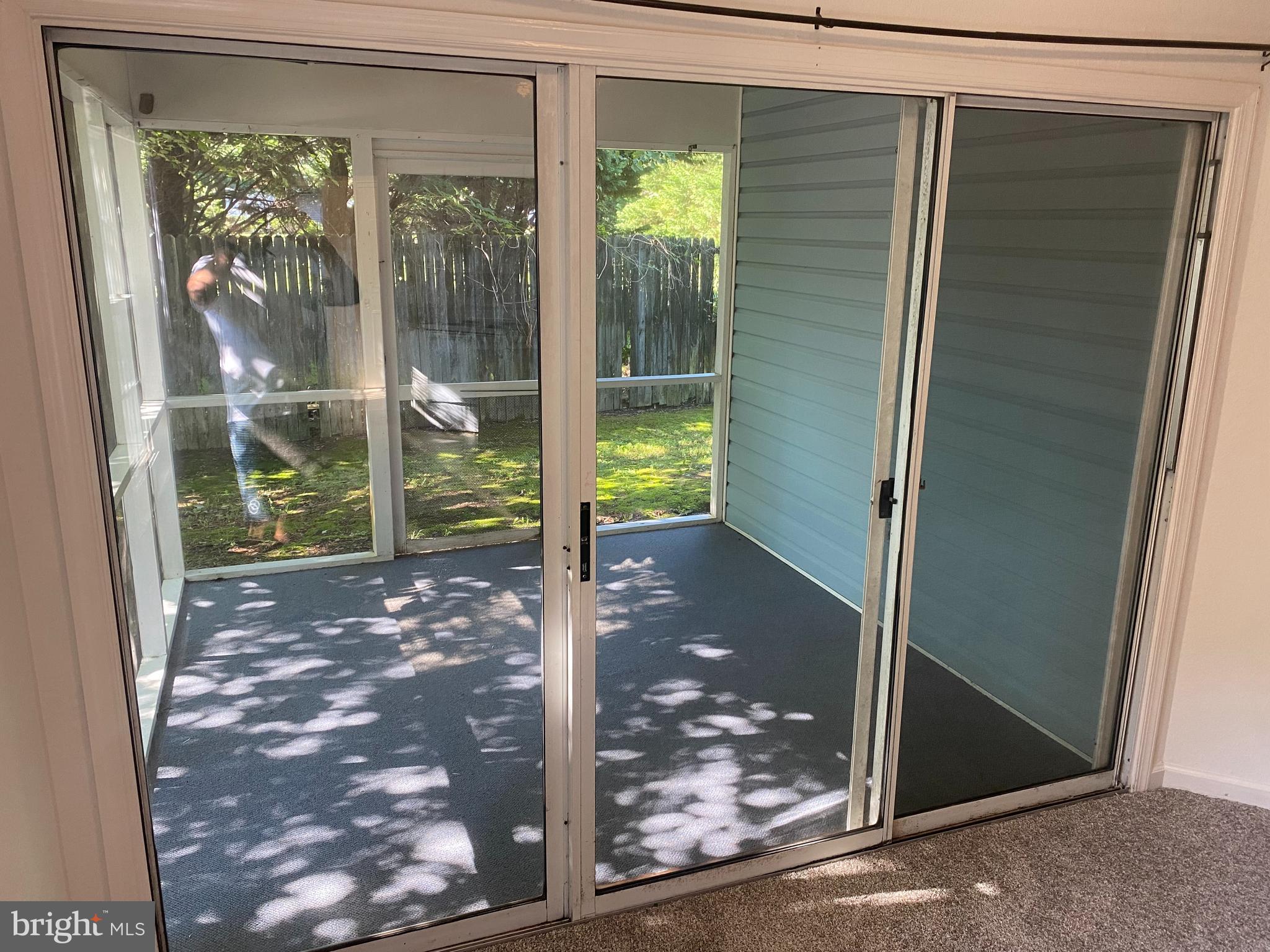 9821 Keyser Point Road, Unit 3B2 Ocean City, MD 21842 - Photo 13 of 13 Screened in porch with new flooring