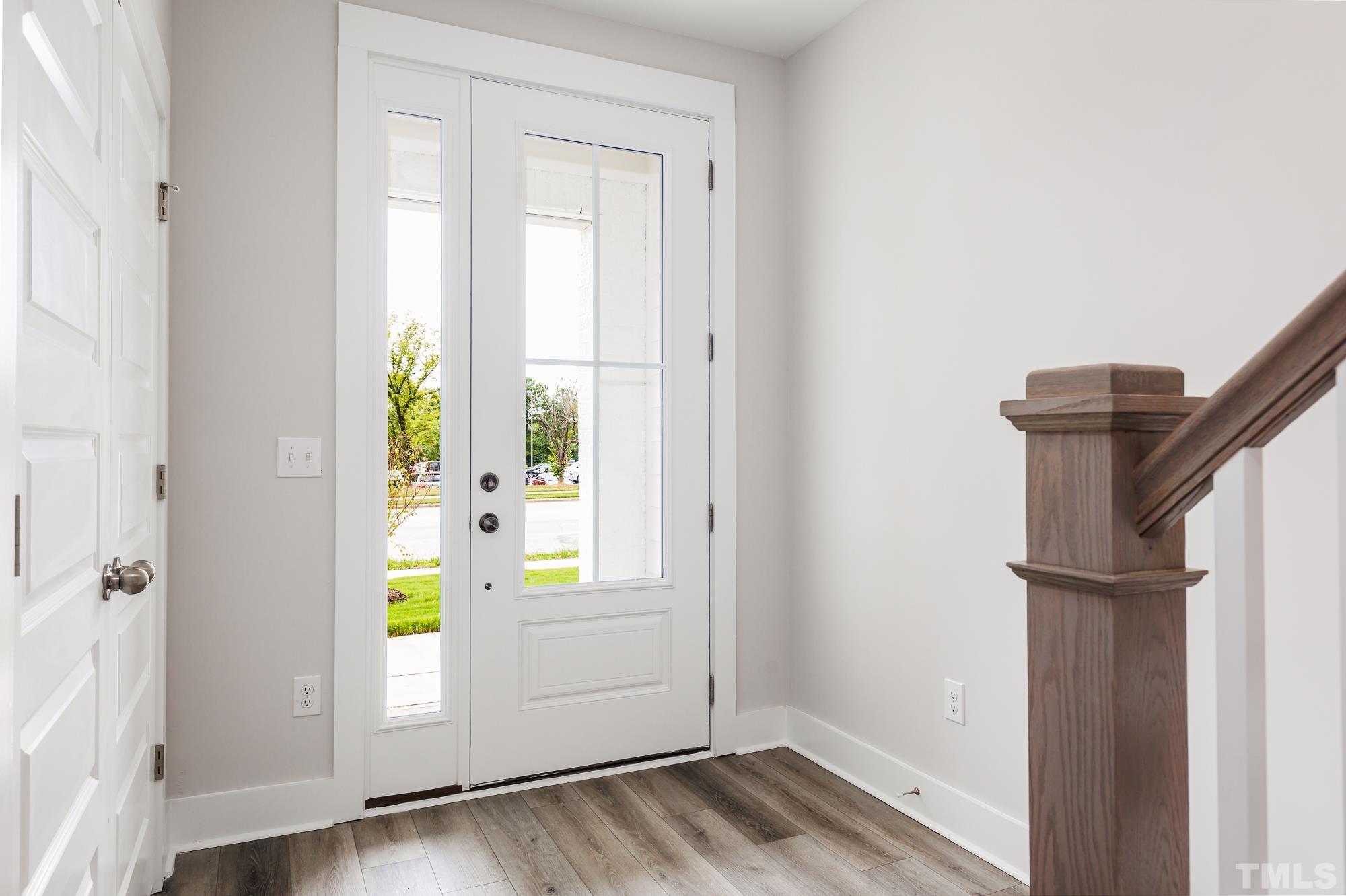 8111 Diversity Way Raleigh, NC 27613 - Photo 1 of 26 a view of an entryway with wooden floor