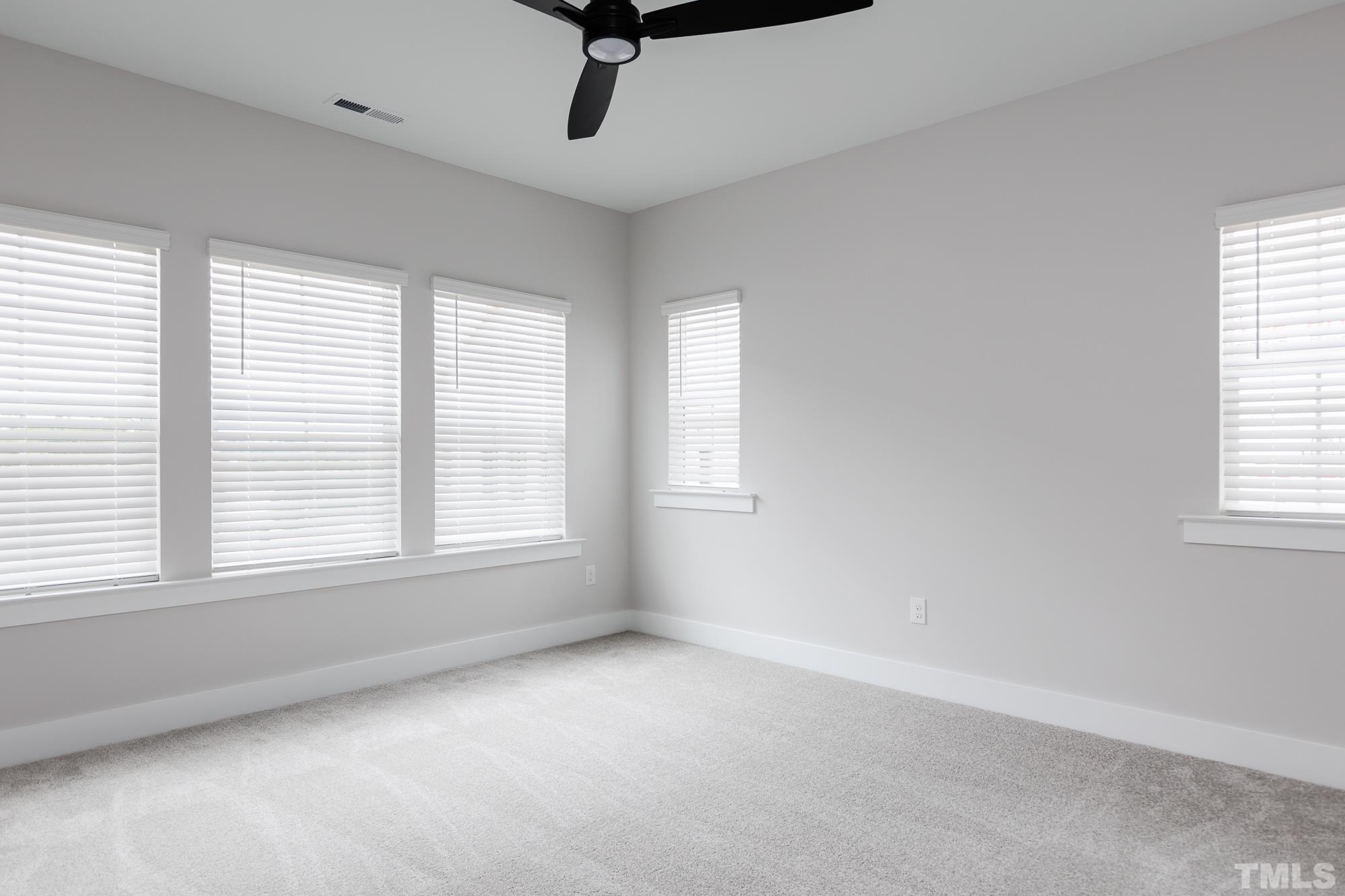 8111 Diversity Way Raleigh, NC 27613 - Photo 13 of 26 a view of an empty room with a window