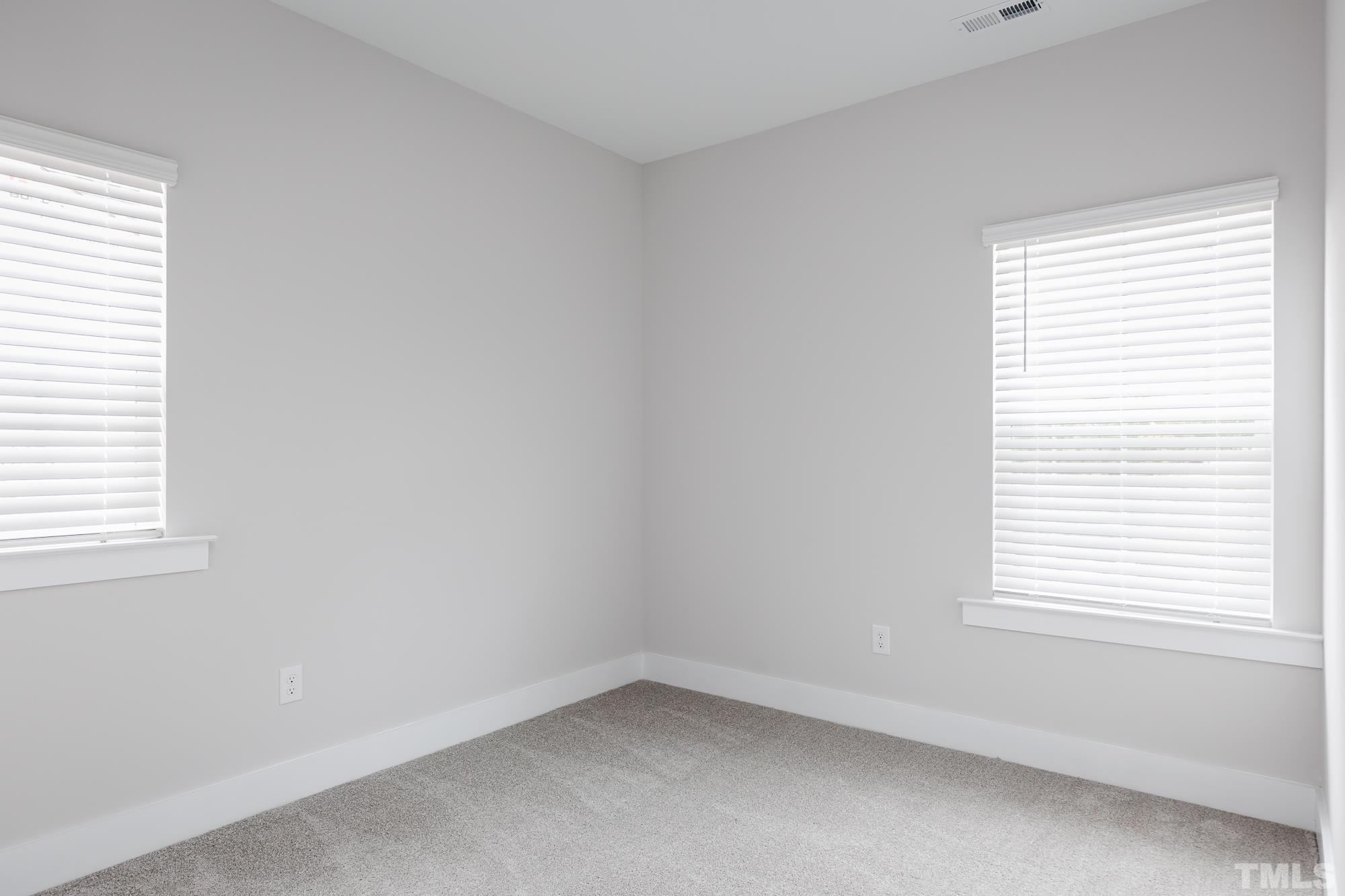 8111 Diversity Way Raleigh, NC 27613 - Photo 20 of 26 an empty room with a window
