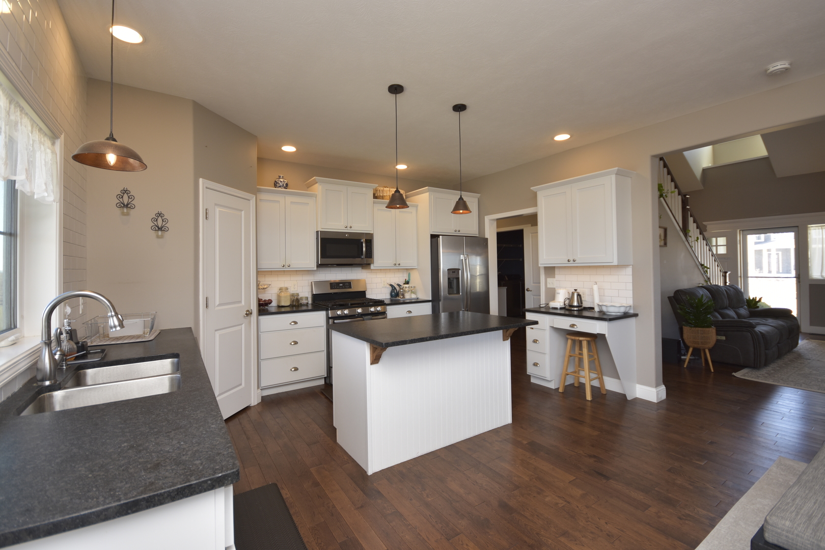 3638 Napa Lane Normal, IL 61761 - Photo 11 of 53 a kitchen with granite countertop a sink cabinets and stainless steel appliances