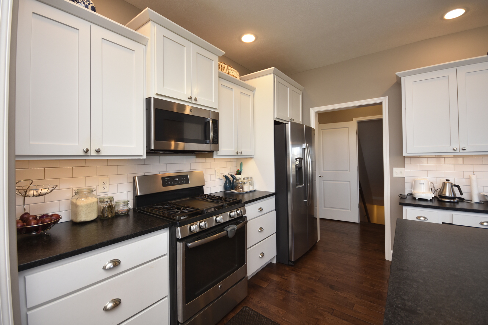 3638 Napa Lane Normal, IL 61761 - Photo 12 of 53 a kitchen with stainless steel appliances granite countertop a stove a sink and a refrigerator