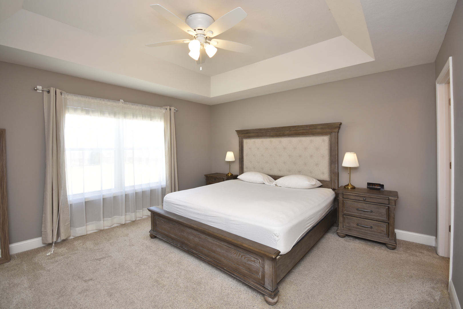 3638 Napa Lane Normal, IL 61761 - Photo 14 of 53 a bedroom with a bed and a chandelier