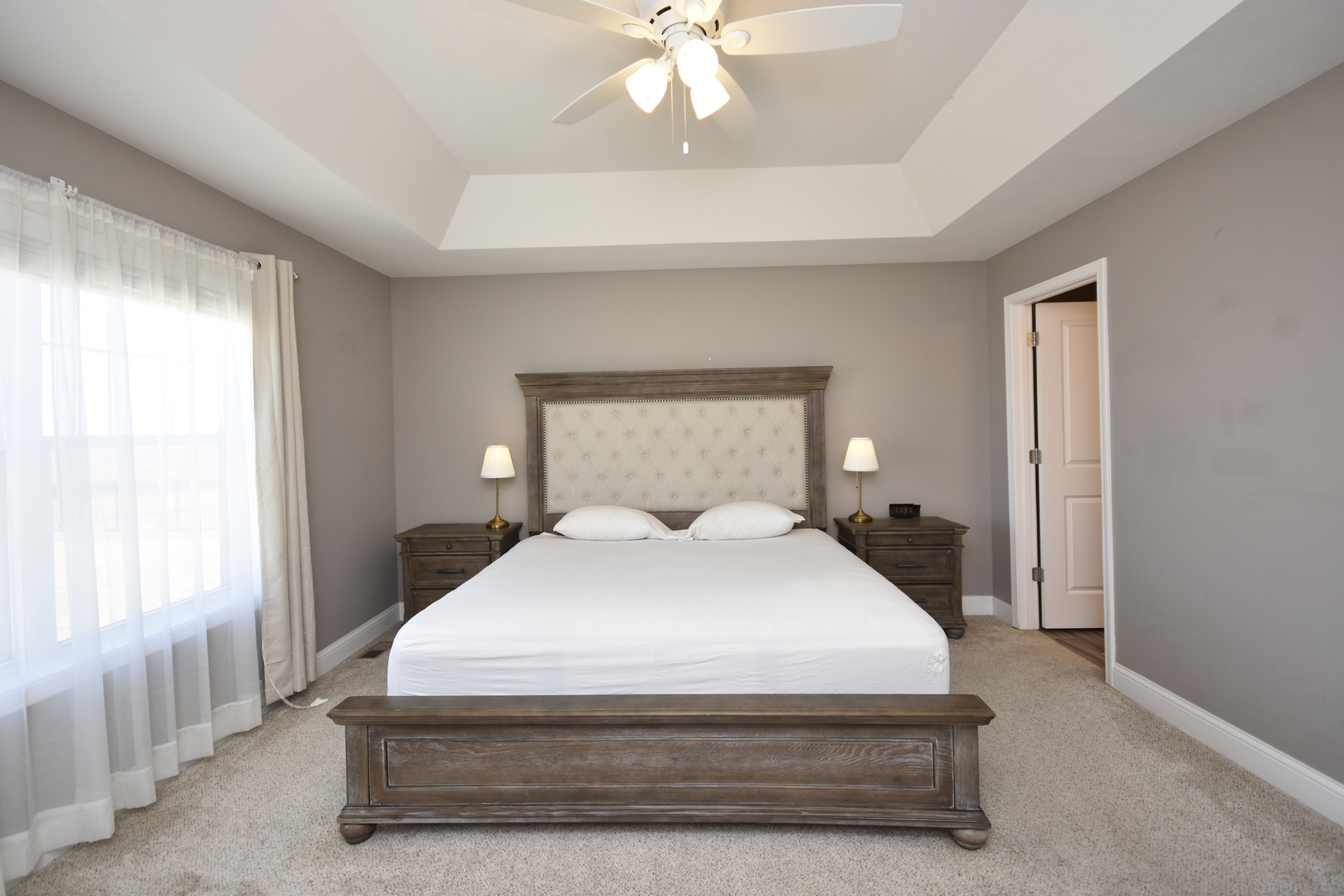 3638 Napa Lane Normal, IL 61761 - Photo 15 of 53 a bedroom with a bed and a chandelier