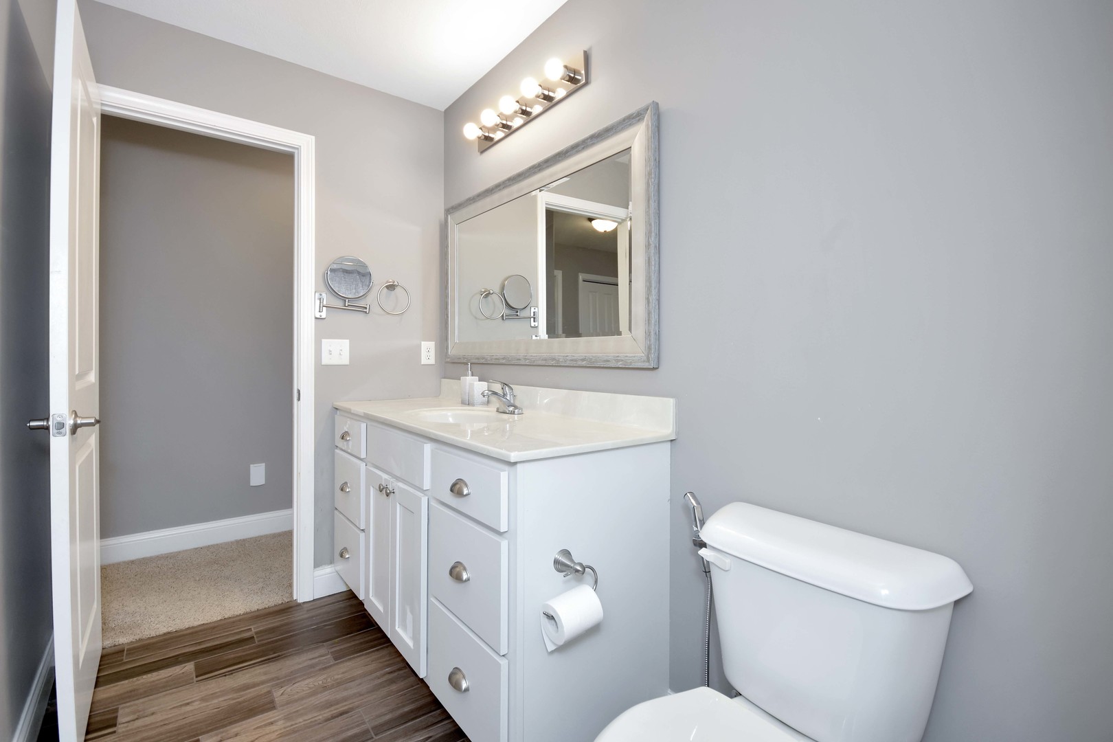 3638 Napa Lane Normal, IL 61761 - Photo 36 of 53 a spacious bathroom with a toilet sink and mirror