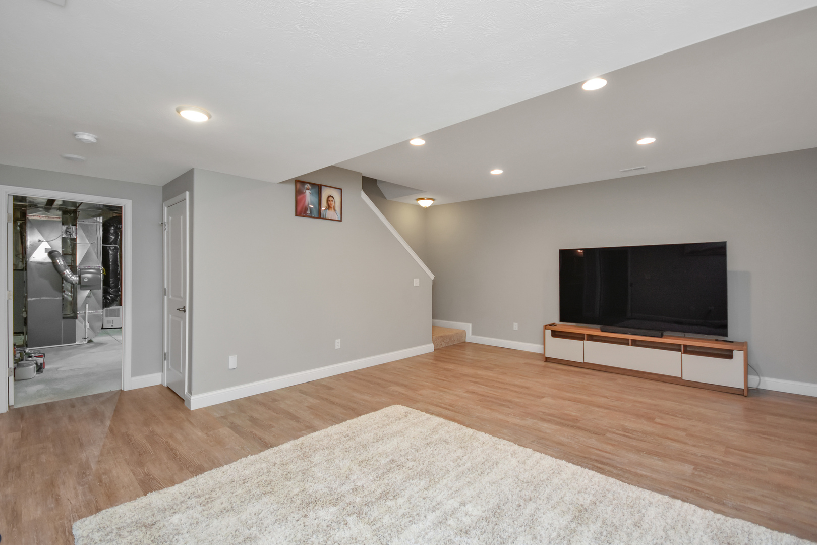3638 Napa Lane Normal, IL 61761 - Photo 38 of 53 a view of a livingroom with wooden floor and a flat screen tv
