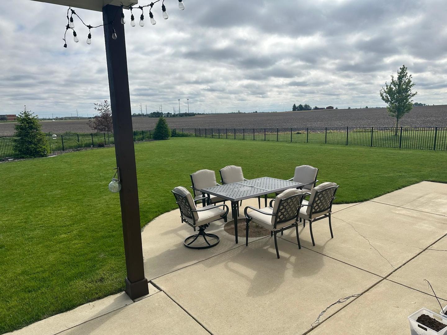 3638 Napa Lane Normal, IL 61761 - Photo 49 of 53 a view of a table and chairs in the garden