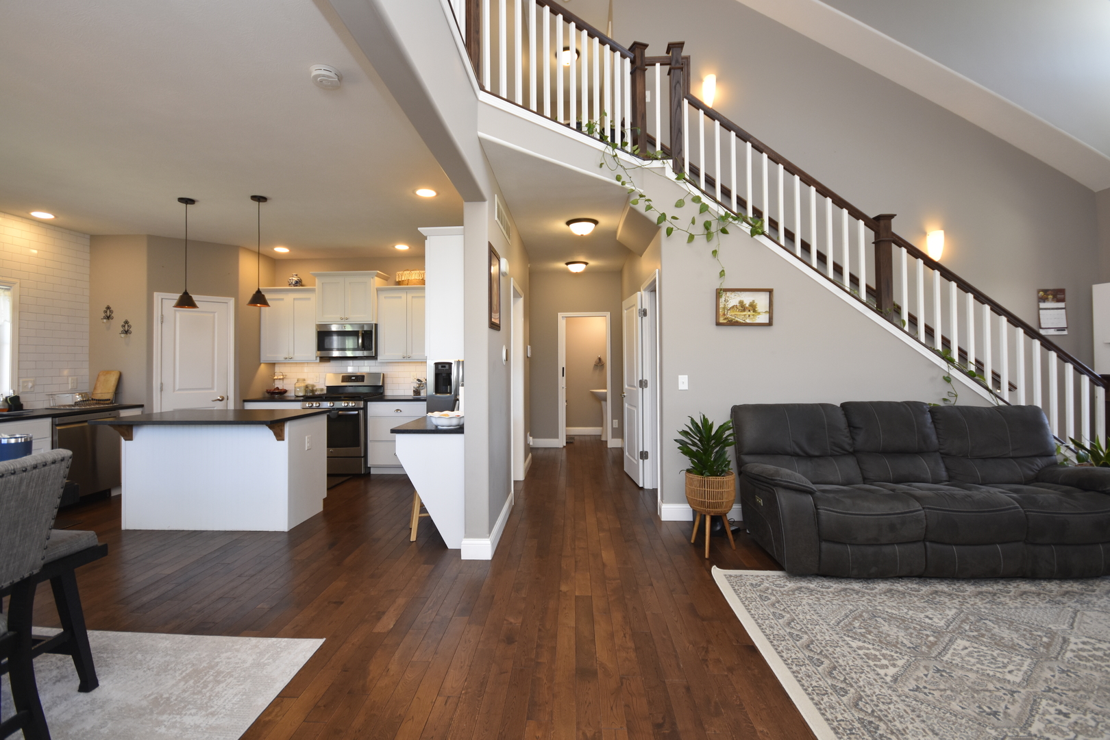 3638 Napa Lane Normal, IL 61761 - Photo 8 of 53 a living room with furniture kitchen view and a wooden floor