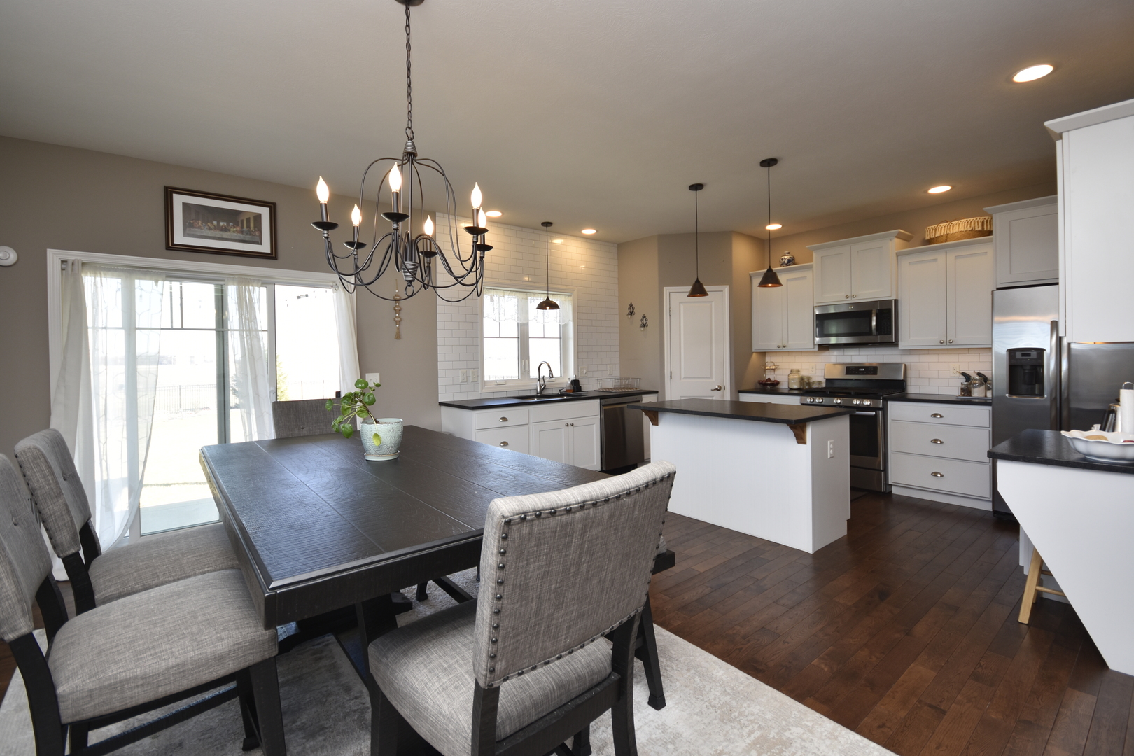 3638 Napa Lane Normal, IL 61761 - Photo 9 of 53 a view of a dining room with furniture a chandelier and wooden floor