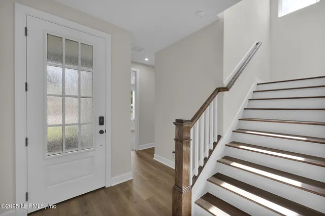 a kitchen with stainless steel appliances granite countertop a sink and stove
