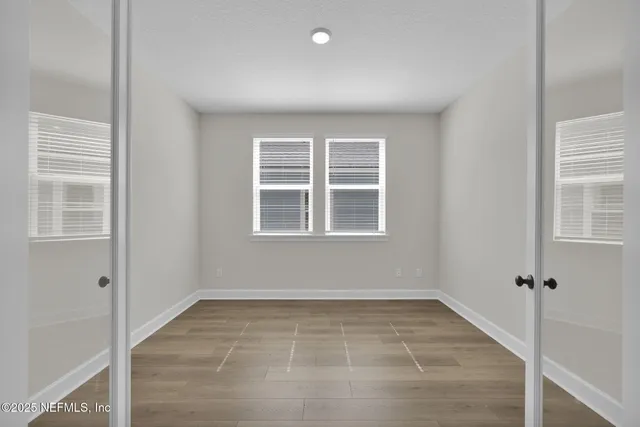 a view of kitchen with wooden floor and window