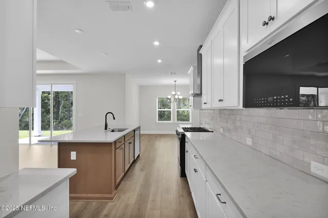 a bathroom with a tub a sink and shower