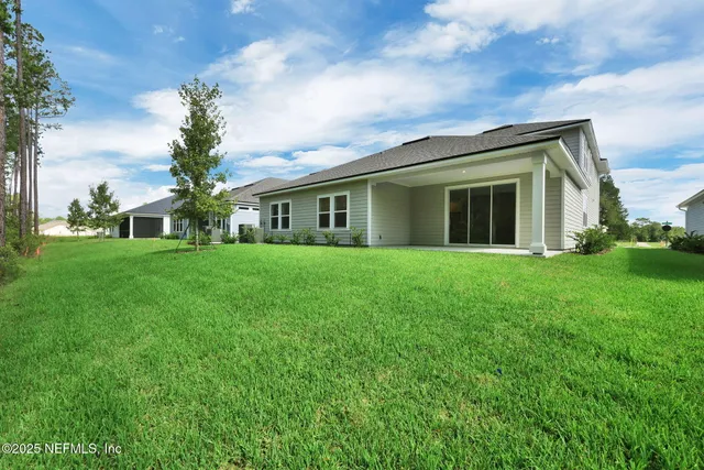 a view of staircase with white walls and windows