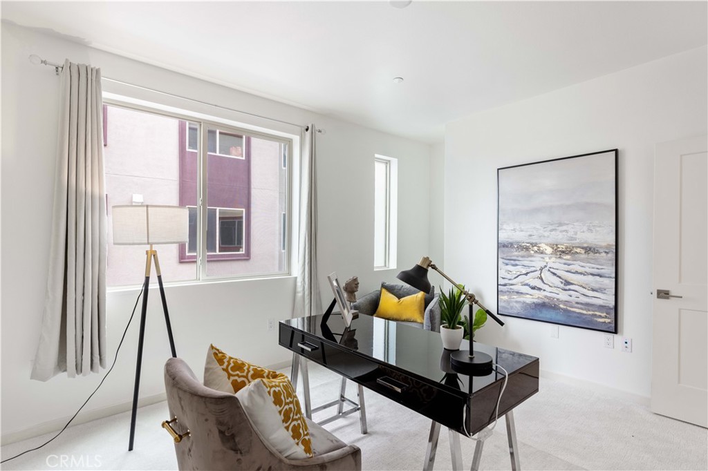 143 Bowery Irvine, CA 92612 - Photo 12 of 32 a living room with furniture and a window