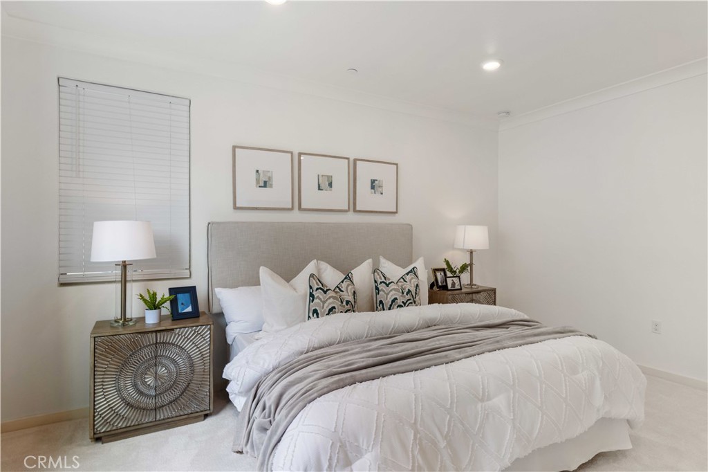 143 Bowery Irvine, CA 92612 - Photo 18 of 32 a bedroom with a bed and a lamp
