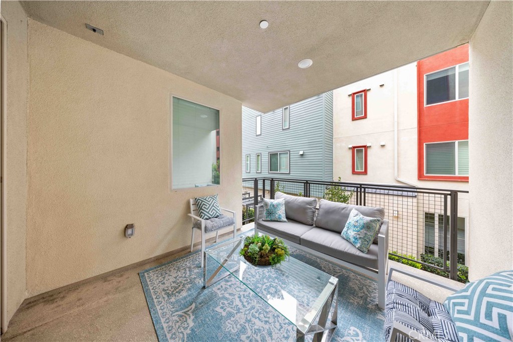 143 Bowery Irvine, CA 92612 - Photo 24 of 32 a living room with furniture and a window