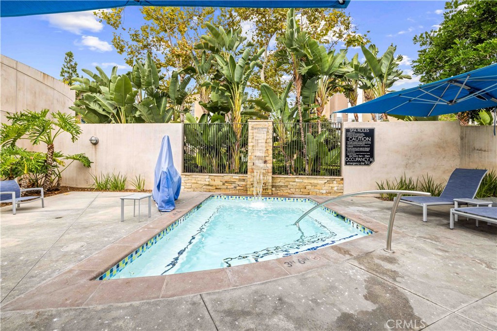 143 Bowery Irvine, CA 92612 - Photo 29 of 32 a view of a swimming pool with a patio