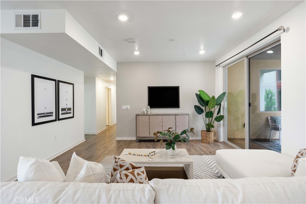 143 Bowery Irvine, CA 92612 - Photo 3 of 32 a living room with furniture and a flat screen tv