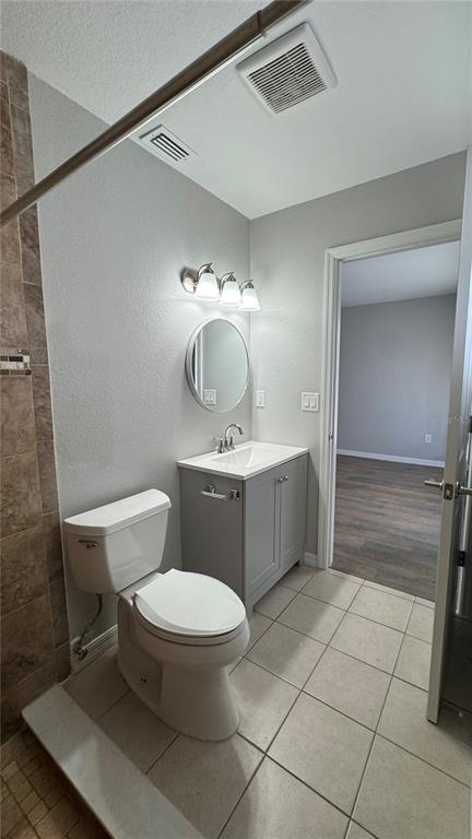 4318 Mongite Road North Port, FL 34287 - Photo 13 of 18 a bathroom with a toilet a sink and mirror