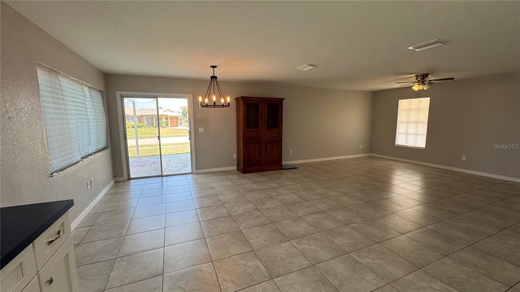 4318 Mongite Road North Port, FL 34287 - Photo 3 of 18 wooden floor in an empty room with a window