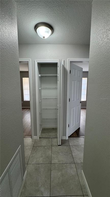 4318 Mongite Road North Port, FL 34287 - Photo 9 of 18 an empty room with a mirror and a fan