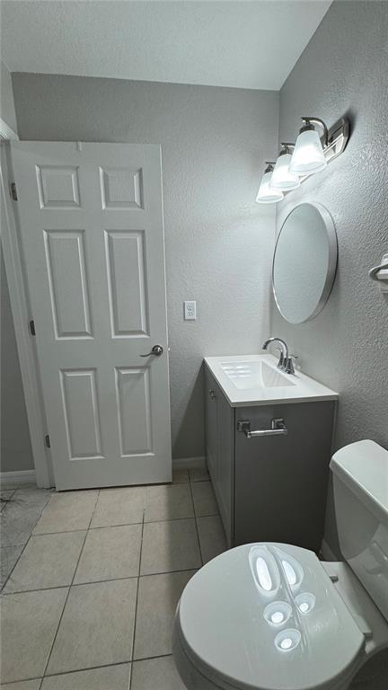 4318 Mongite Road North Port, FL 34287 - Photo 10 of 18 a bathroom with a toilet sink and mirror