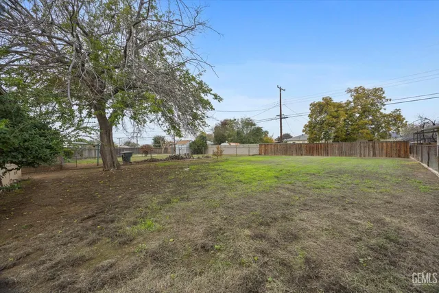 a view of a field with tree in the background