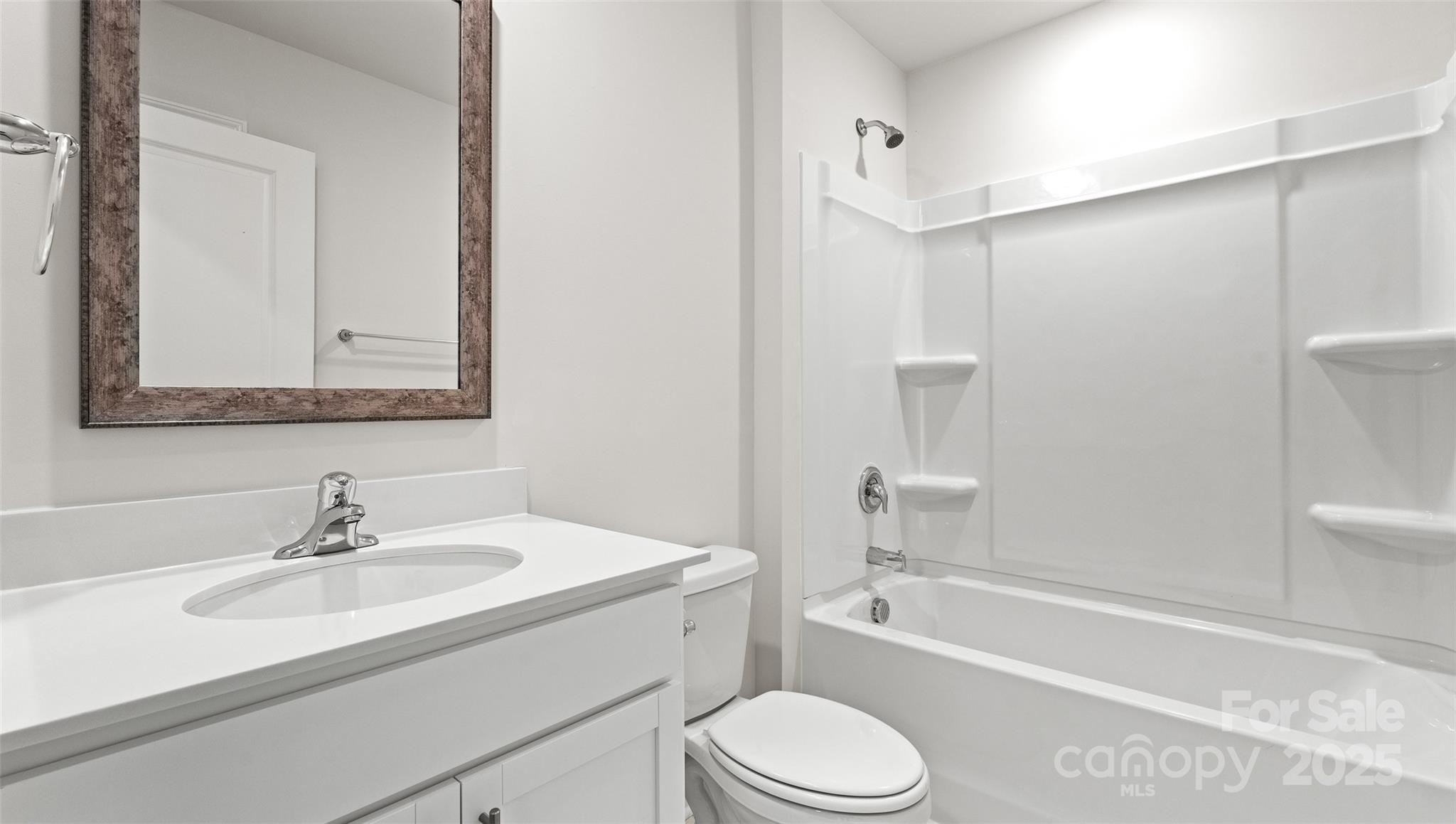 212 Callie River Clyde, NC 28721 - Photo 15 of 25 a bathroom with a sink toilet and shower