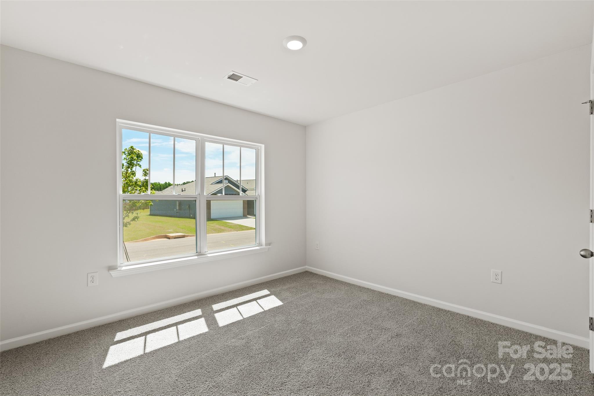 212 Callie River Clyde, NC 28721 - Photo 22 of 25 an empty room with a window