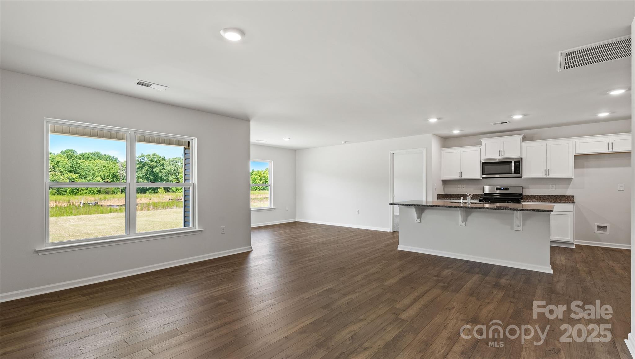 212 Callie River Clyde, NC 28721 - Photo 8 of 25 a view of kitchen with stainless steel appliances granite countertop a stove top oven