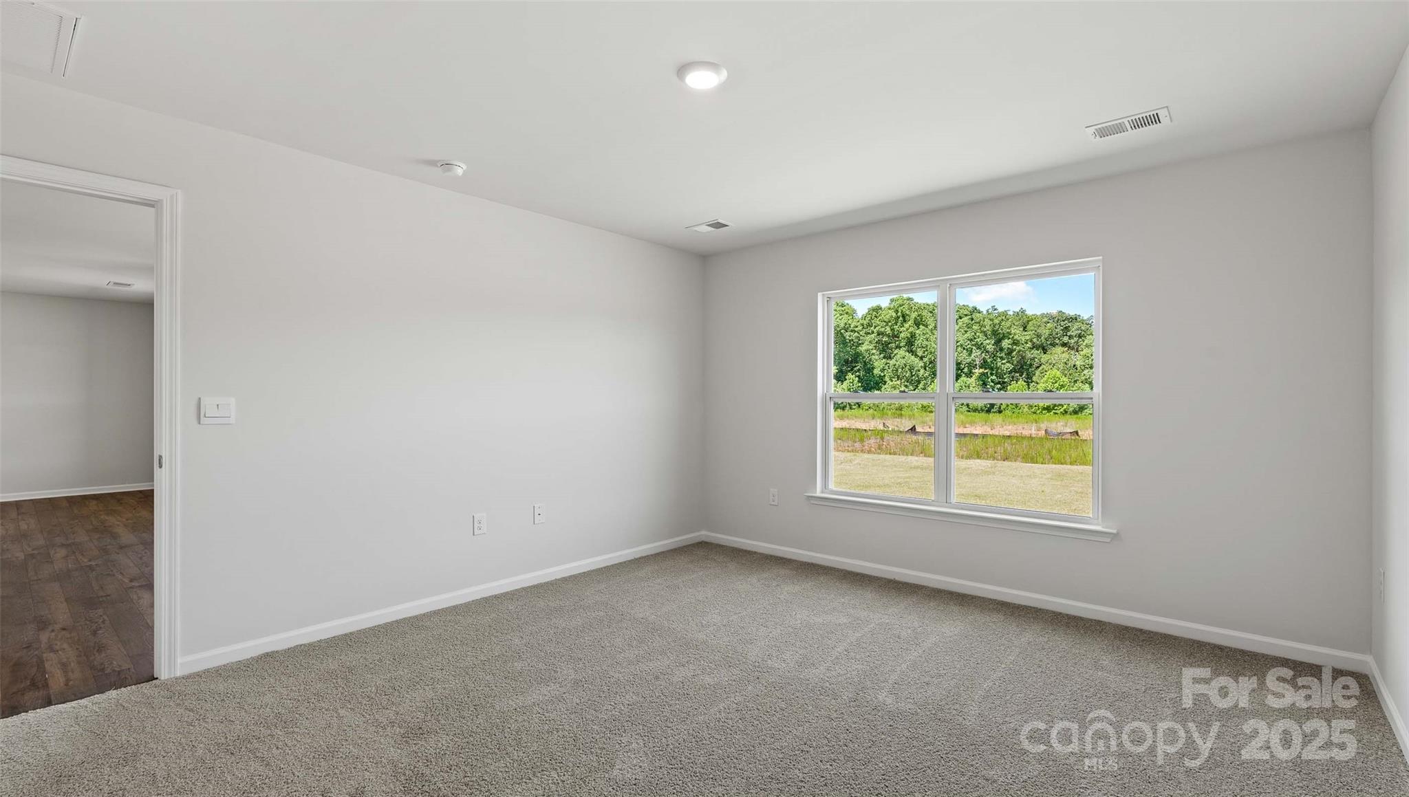 212 Callie River Clyde, NC 28721 - Photo 10 of 25 an empty room with a window