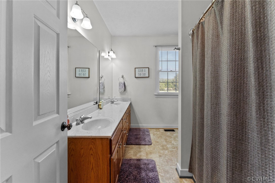 746 Mill Road King William, VA 23086 - Photo 32 of 48 Hall bath shared by bedrooms 2 and 3