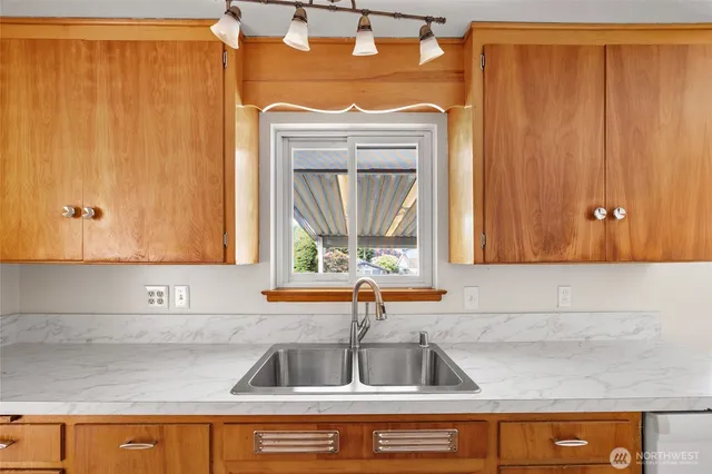 a kitchen with a sink and a cabinets
