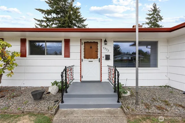 a view of a house with a potted plant