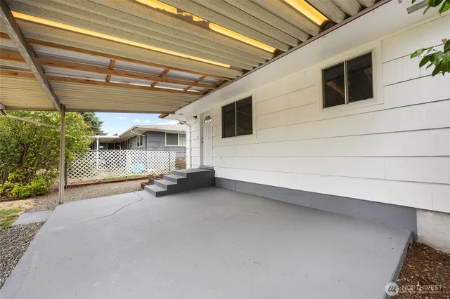 a view of a room with wooden walls