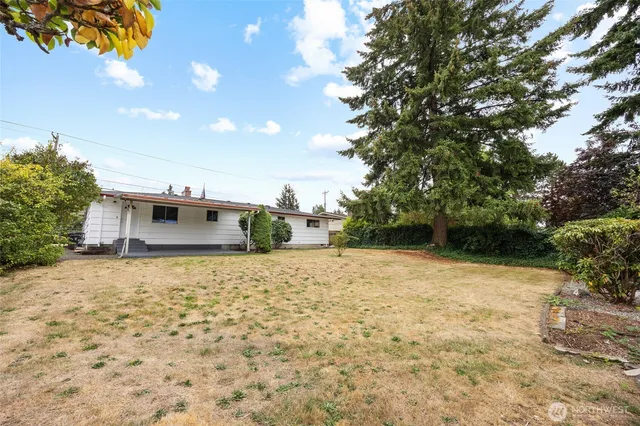 a backyard of a house with lots of green space